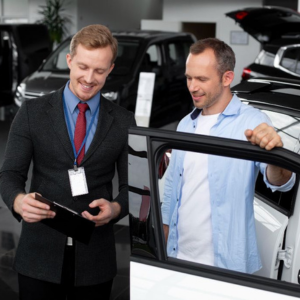 A proficient salesperson is depicted providing guidance to a client in an automotive setting, representing the expertise gained through the Diploma of Automotive Management at Sheffield College. The photo emphasizes the program's comprehensive education in automotive sales, marketing, and management. Students acquire specialized skills to excel in commercial roles within the automotive industry, driving business success and customer satisfaction.